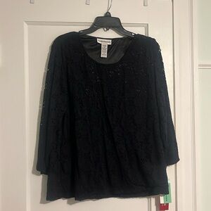 Lace top, 2nd layer on torso area. Sleeves lace only. Stretchy material